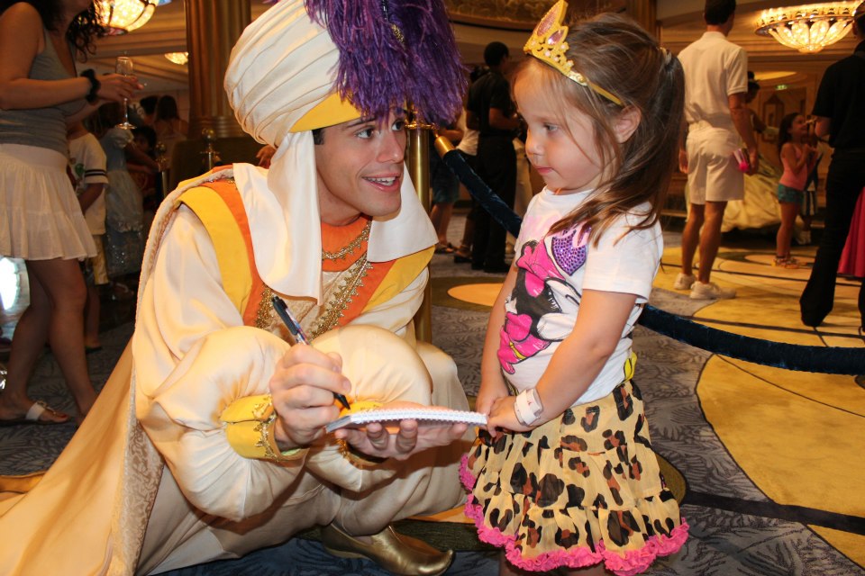 Little girl meeting Aladdin on Disney Cruise 