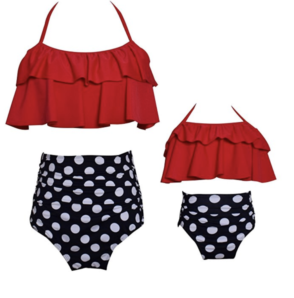 A mother-daughter matching swimsuit set. Red bikini top and black and white polka dot bottoms